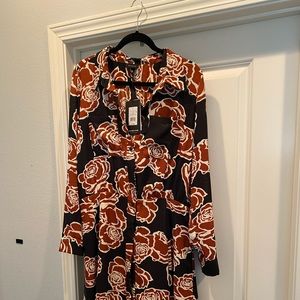 New with tags...black, rust, creme colored print dress.  3/4 length.